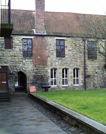Those tall windows on both sides of the refectory allowed light for Bible reading during dinner